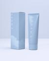 Covey skincare “First Of All” cleanser product bottle and box packaging design in studio lighting on a blue background