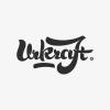 Ukraft paleo snack bar logo in abstract script typography by Transatlantika.