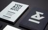 Von and Zu Buch Book Store business cards laid flat and arranged neatly next to each other at an angle on a black background in studio lighting