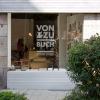 Von and Zu Buch Book Store retail storefront, with vinyl lettering on the glass exterior